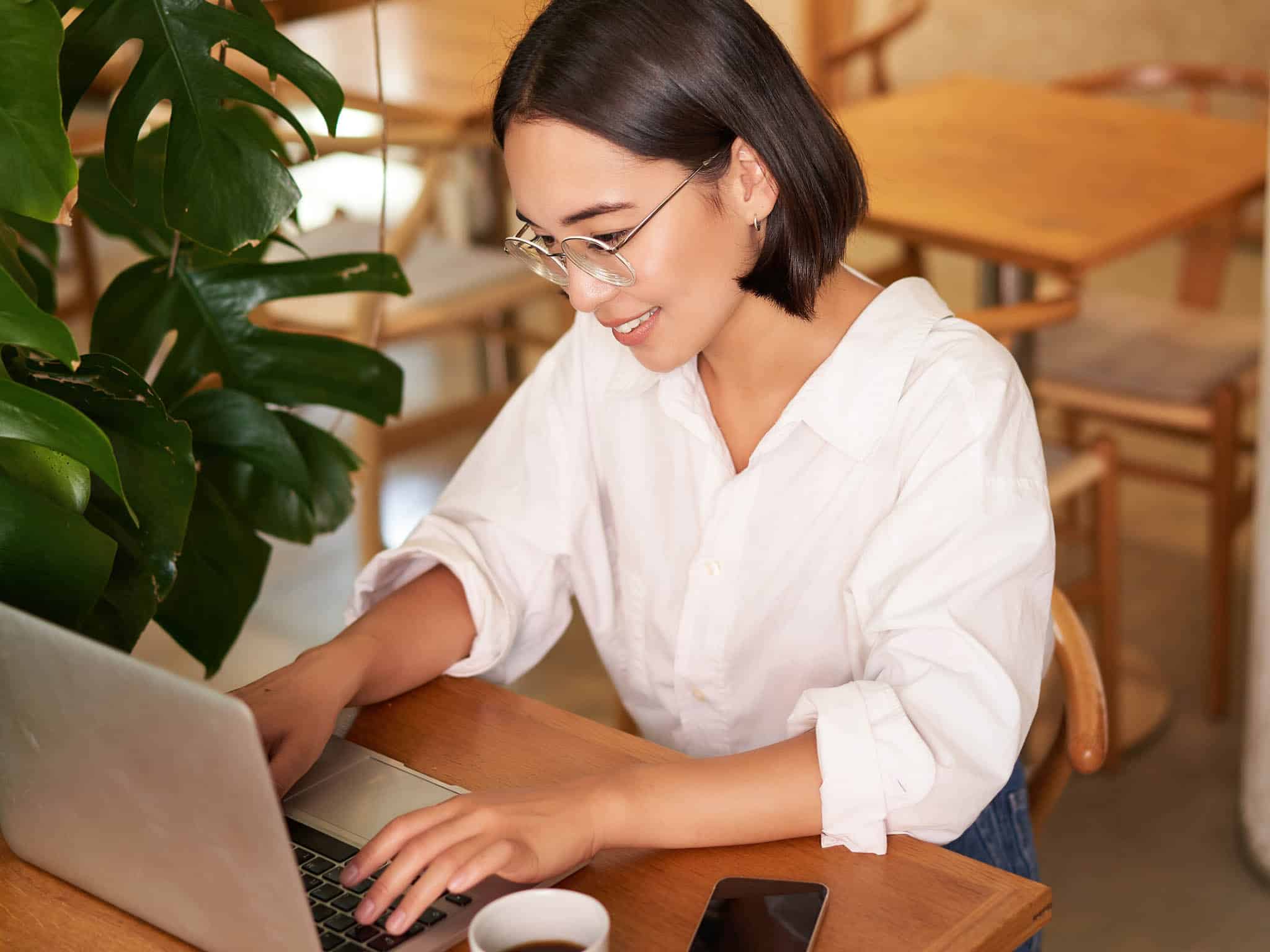 woman-writing-in-cafe-resized